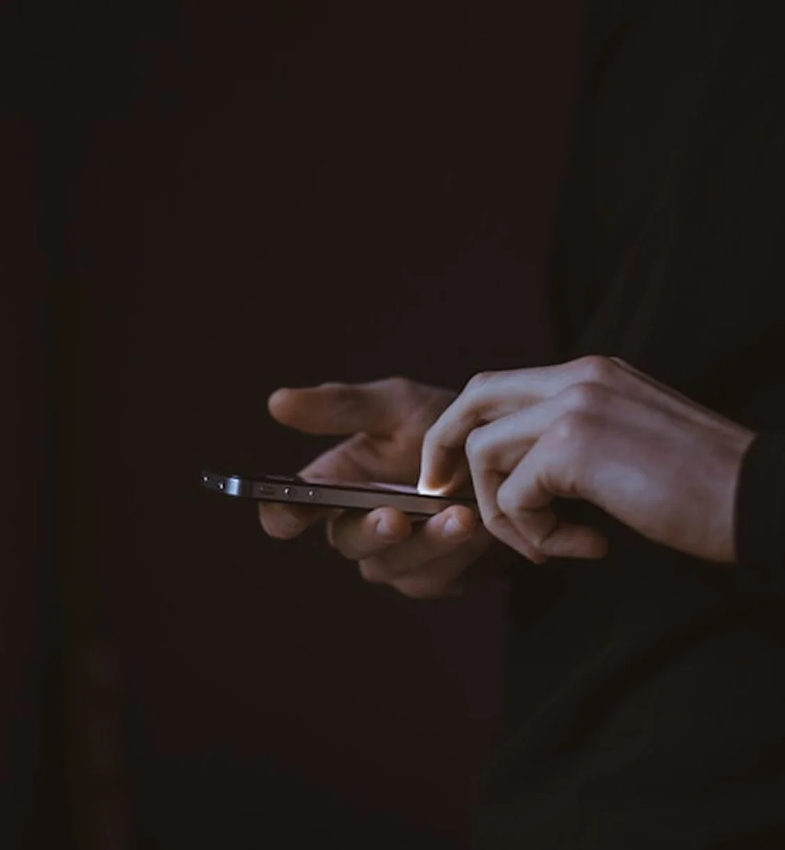 Hands answering questions on a phone